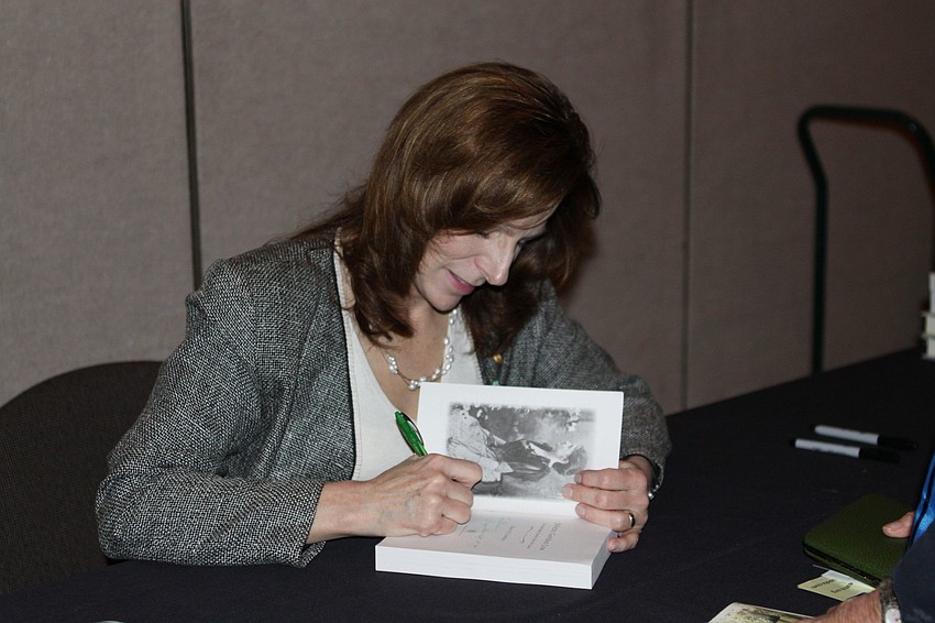 Stacy Cordrey signing her book.