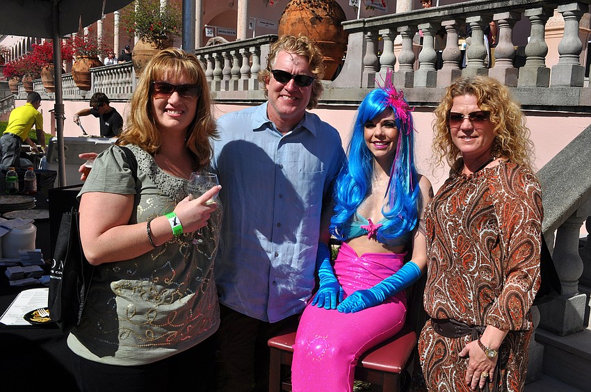 Colleen Teague, Pat Lennon and Danielle Lennon had fun posing with Virginia Hughes, dressed as a mermaid.