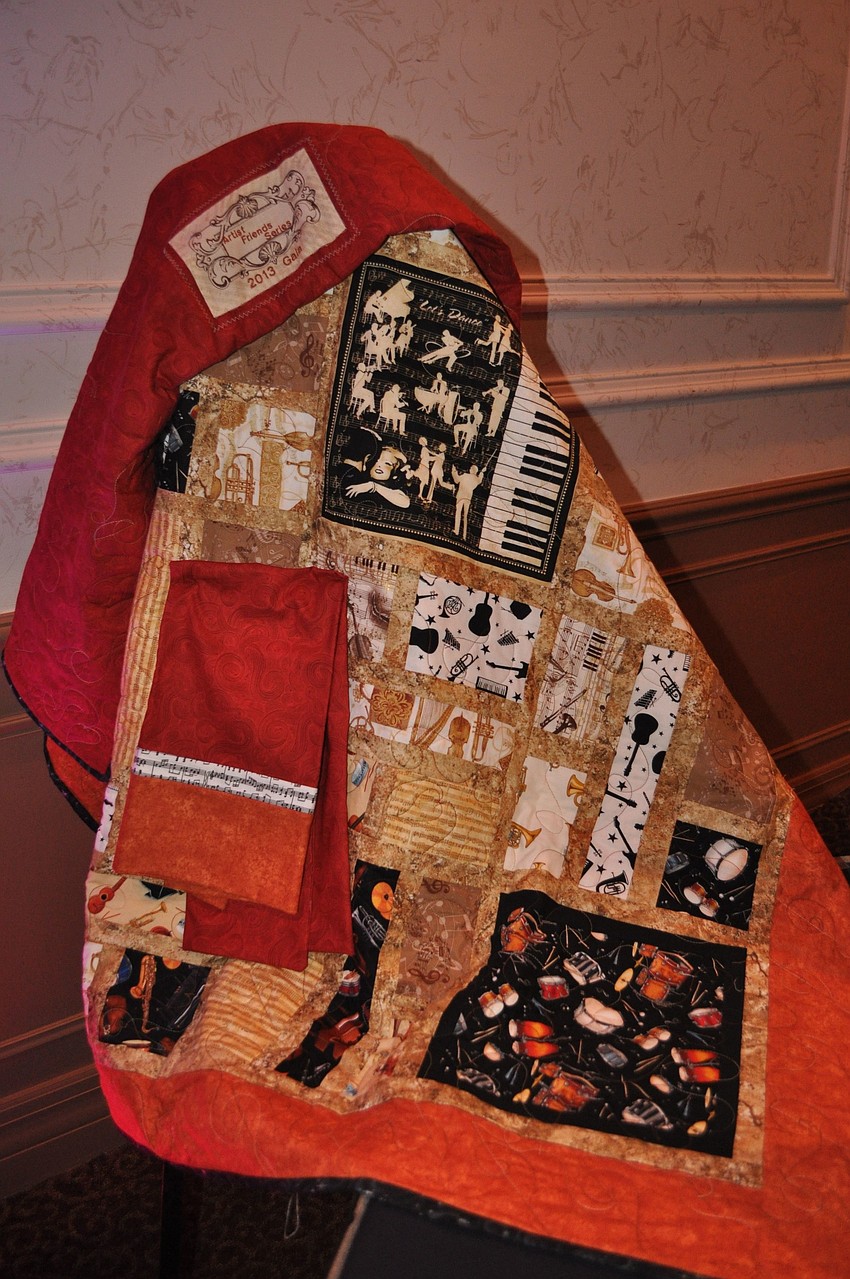 A homemade, music quilt made by Jennifer Meinhart was one of the many things up for bidding on at the silent auction.