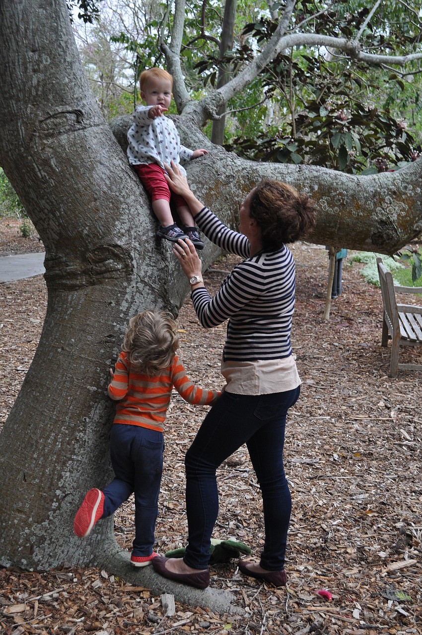 Mindy Rollins keeps her children Eve, 1, and Magnus, 4, entertained during the reception.