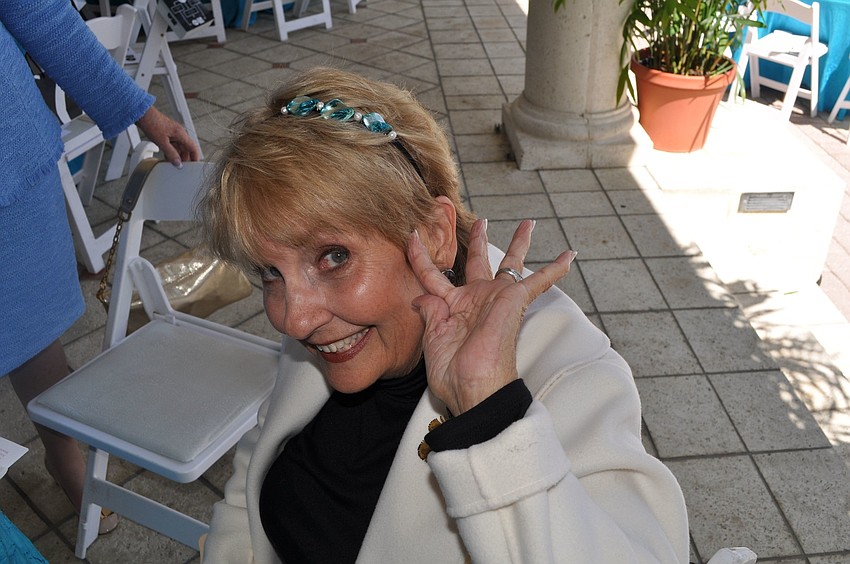 Eileen Williams models the free headband everyone got at their seat made by A Whirl and A Twirl.