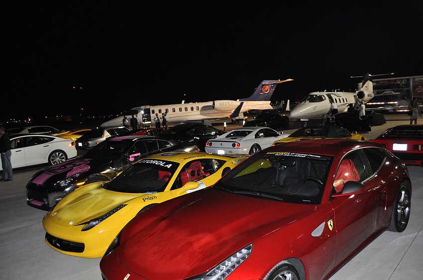 There were plenty of exotic cars and luxury planes on display Friday night.