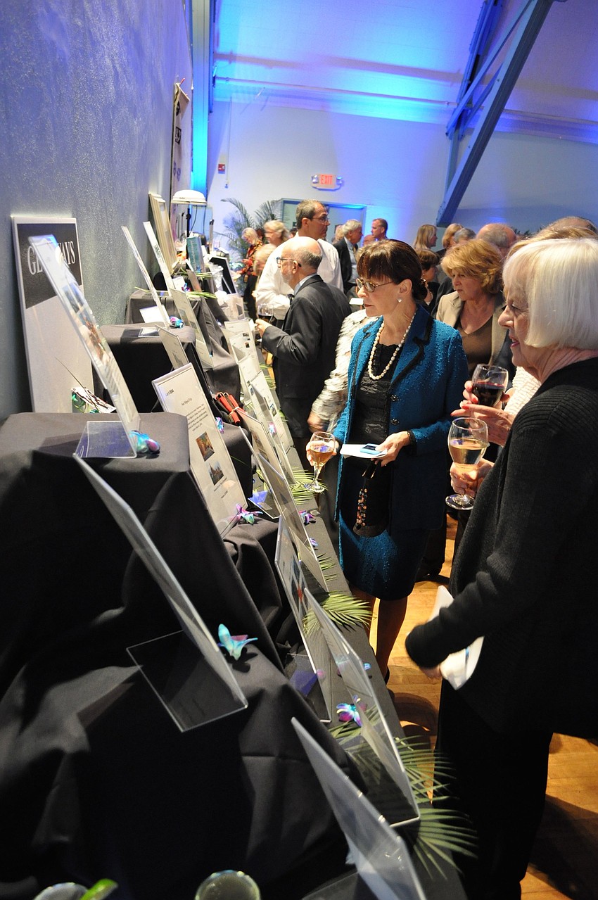 People look at some of the items up for auction.