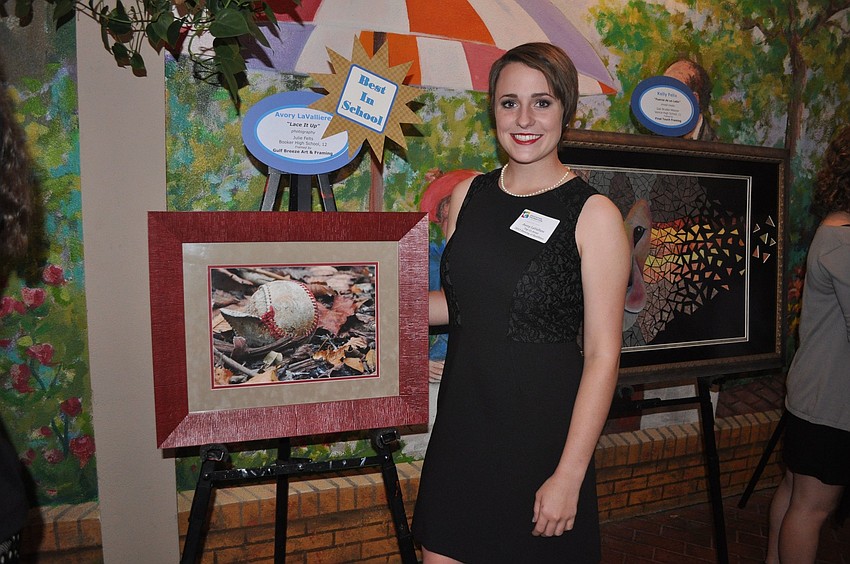 Avory LaValliere with her piece â€œLace It Upâ€.