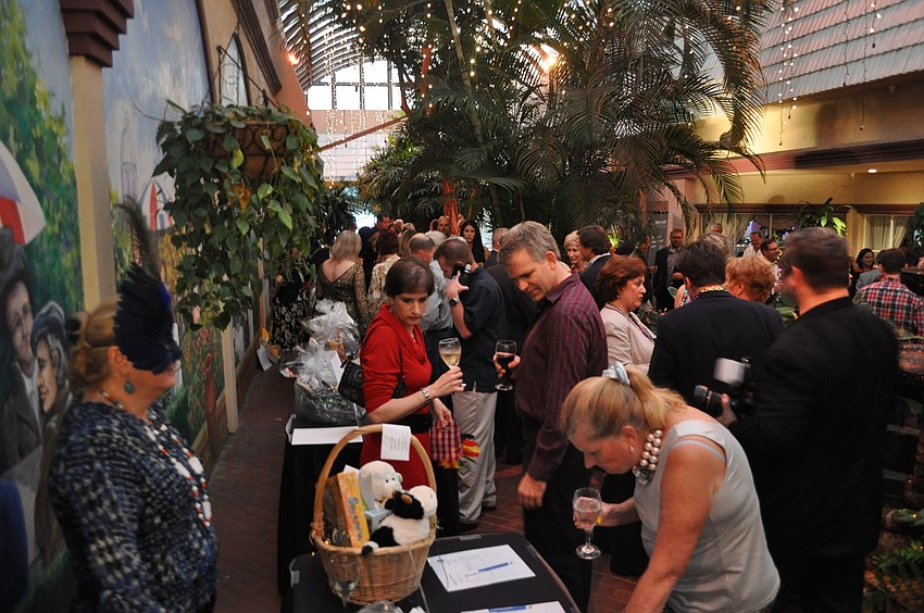 People wandered the courtyard and bid on items at the silent auction.
