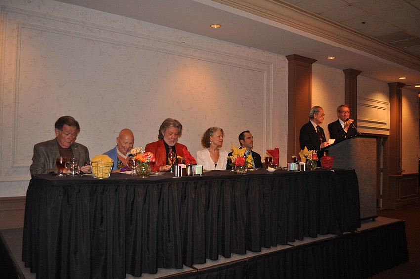 Ed Alley, June LeBell, Samuel Ramey, Stephanie Sundine and Paul Caragiulo sit at the head table on stage while the chairmen Bert Fivelson and John Halstead speak to the crowd.