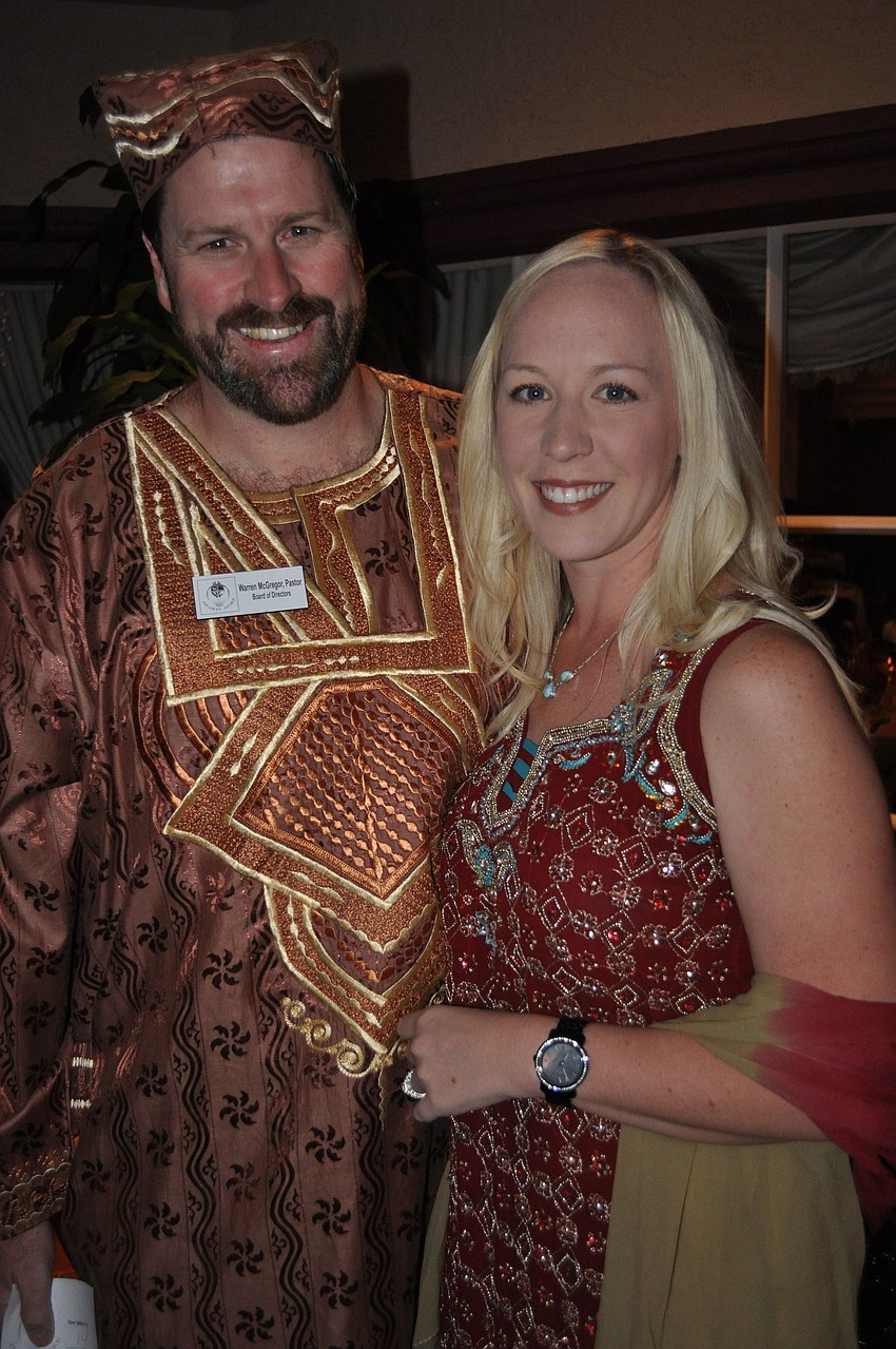 Rev. Warren and Kathrine McGregor wore outfits from Kenya and India to the benefit.