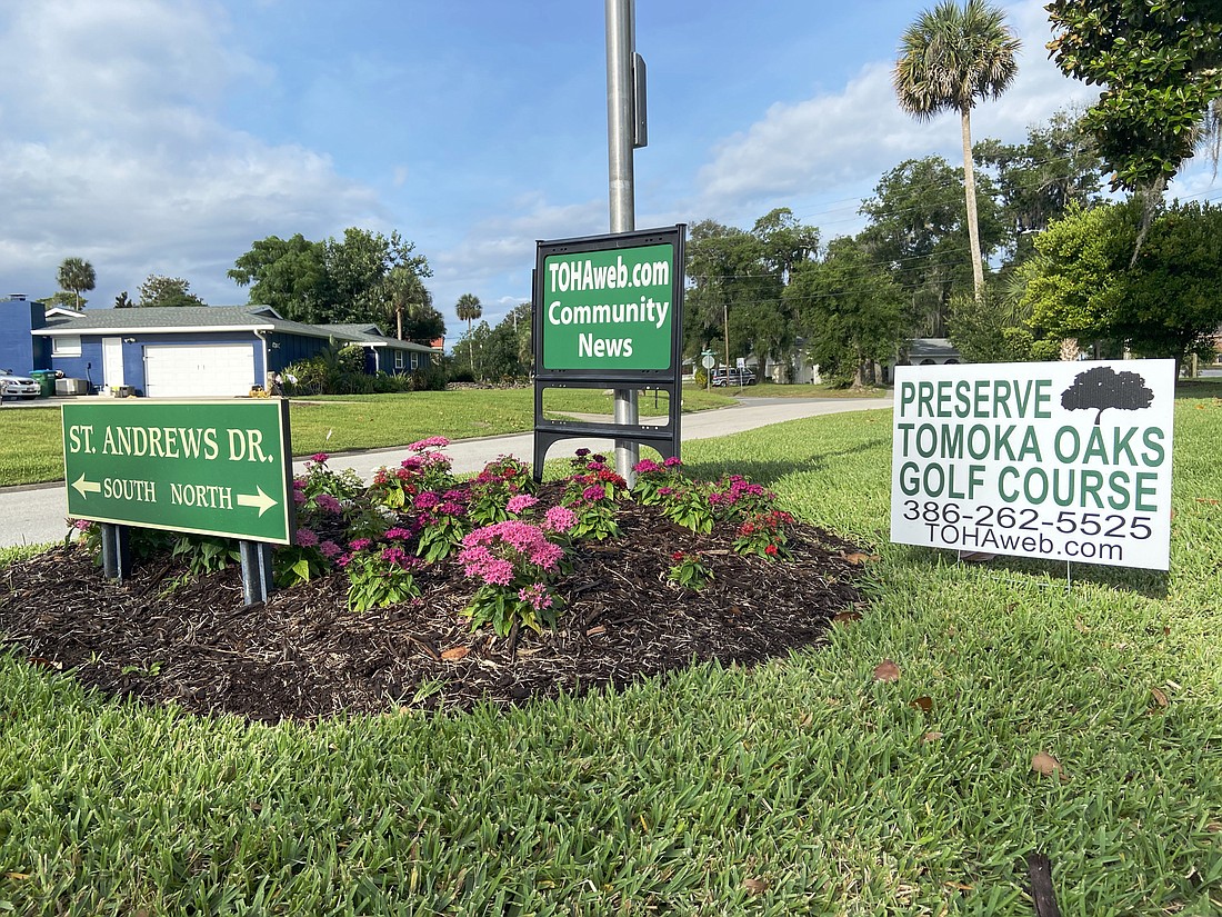 Many Tomoka Oaks residents have signs on their front lawns and common areas that advocate to preserve the golf course. Photo by Jarleene Almenas