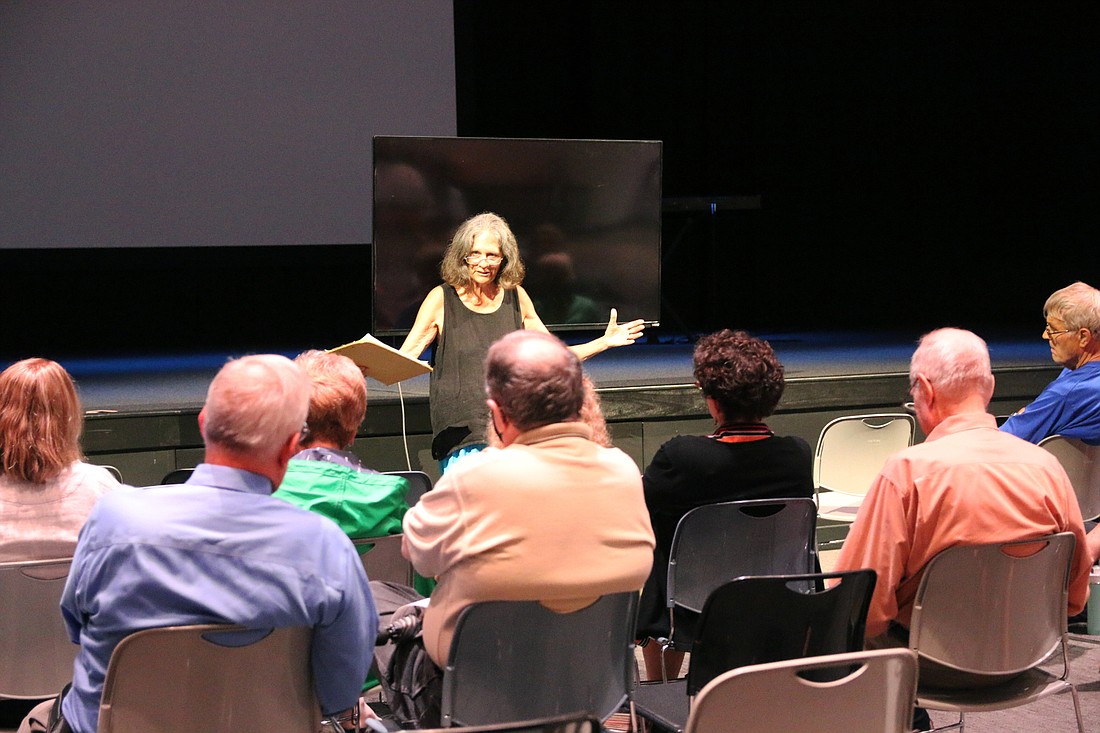 Linda Williams, founder of Civil Discourse, moderates the meeting at Salty Church. Photo by Jarleene Almenas