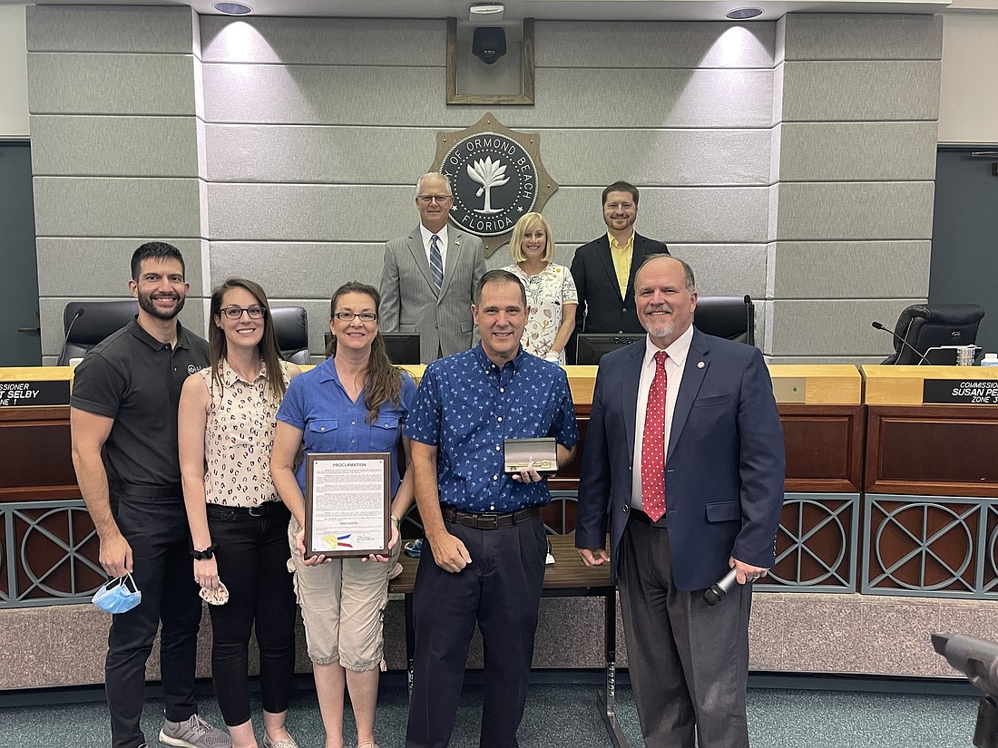 Former IT Director Ned Huhta, his family, Mayor Bill Partington and the Ormond Beach City Commission. Courtesy of the city of Ormond Beach