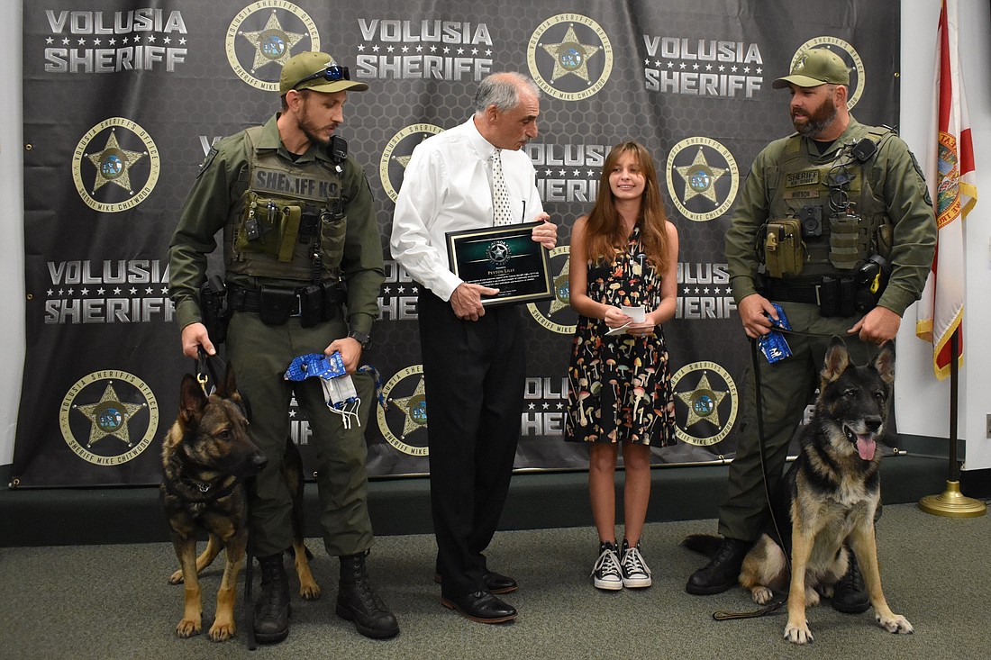 K-9 Deputy A.J. Davis and Ax, Sheriff Mike Chitwood, Peyton Lilly, and K-9 Deputy Brett Whitson with Endo. Courtesy photo