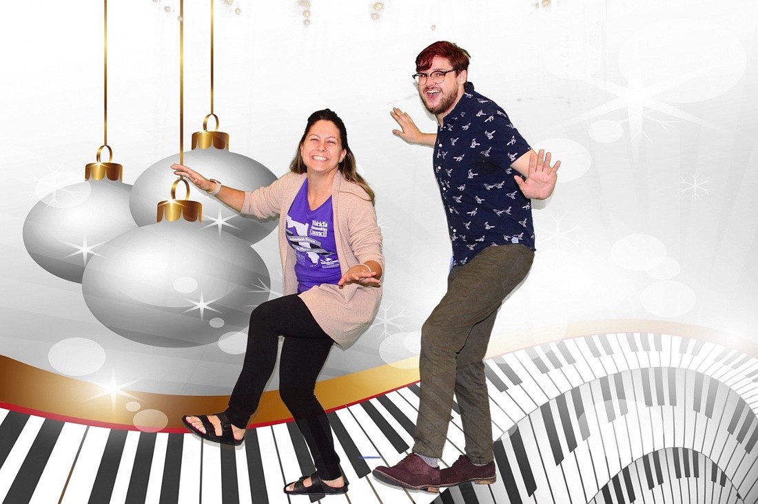 Barbara Bogdan Butler and Christopher Johnson, library assistants at the Daytona Beach Regional Library, have fun with green screen photography. Courtesy photo