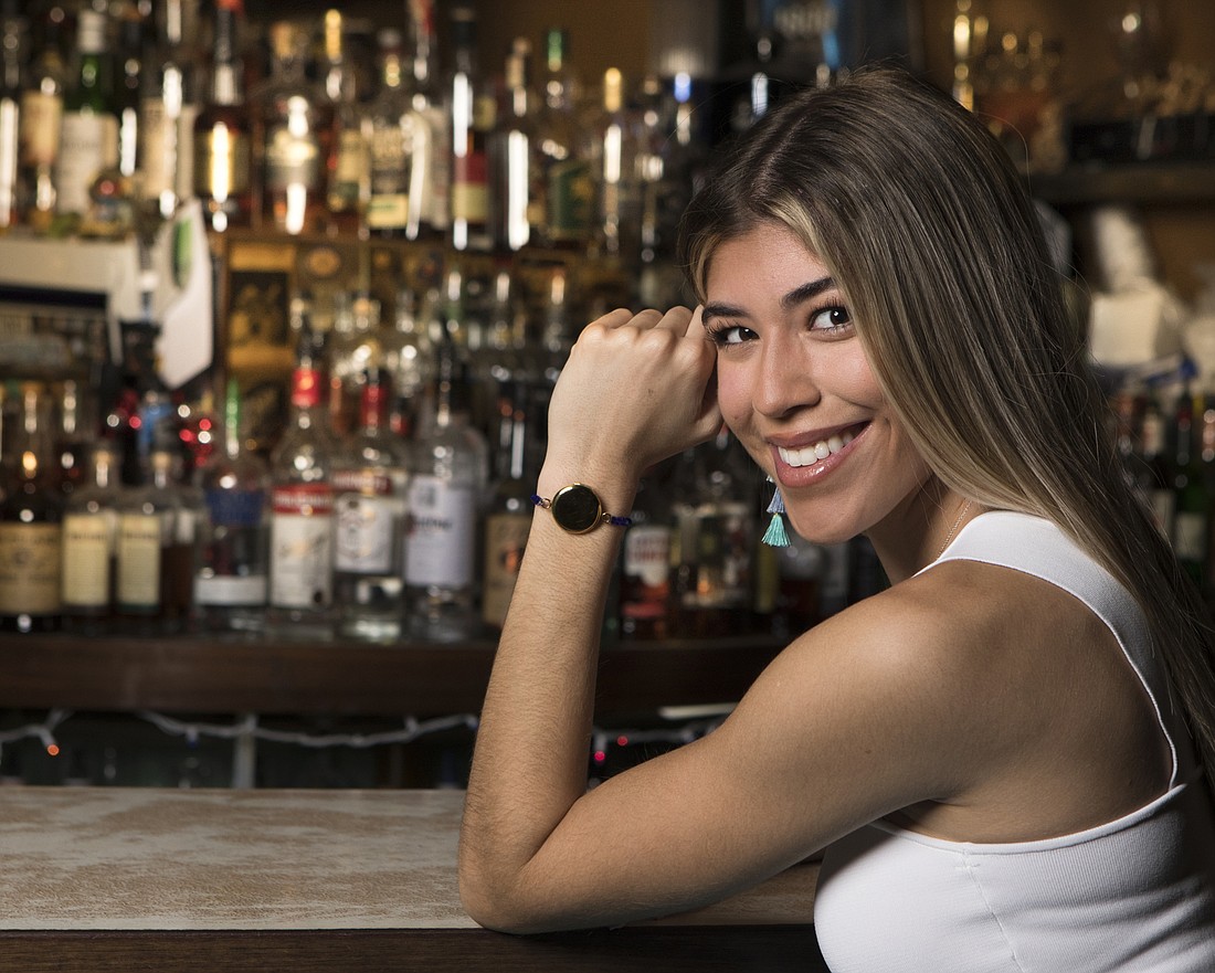 Mark Wemple. University of Tampa business student Alexsandra Wolfe is the founder and CEO of Puresipity, which makes a bracelet that can help women test drinks for date-rape drugs.
