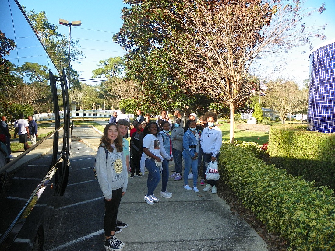 Ormond children prior to boarding the bus to the Orlando Magic game on Dec. 23. Courtesy photo