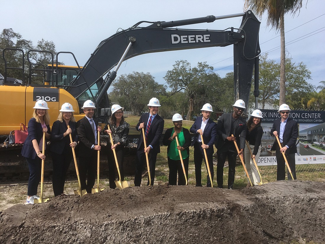 Cathie Wood, fourth from left, and her ARK Investment Management team break ground for the new ARK Innovation Center in St. Petersburg on Tuesday, Feb. 15. (Photo by Brian Hartz)