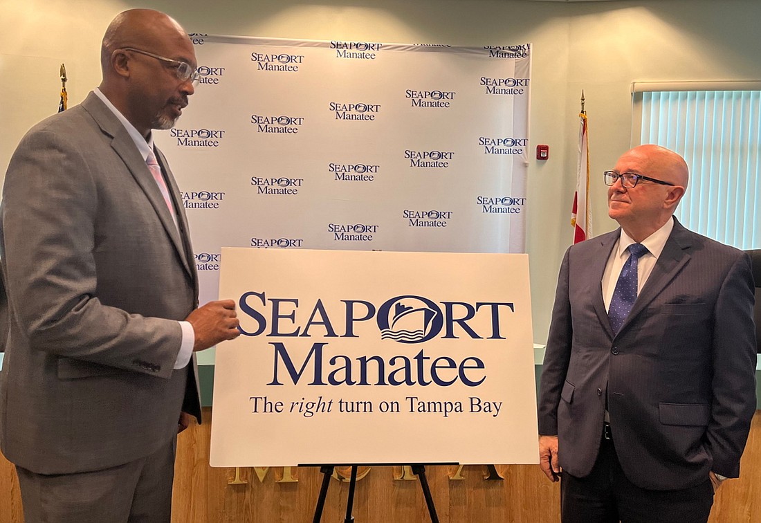 Reggie Bellamy, left, and Carlos Buqueras unveil the new SeaPort Manatee logo. (Courtesy photo)