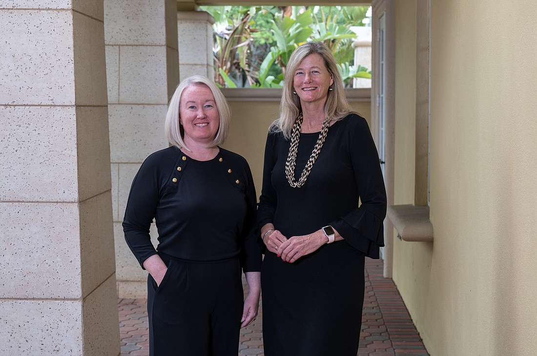 Erin Jones and Laura Spencer have worked together at the Community Foundation of Sarasota for a decade. (Photo by Lori Sax)