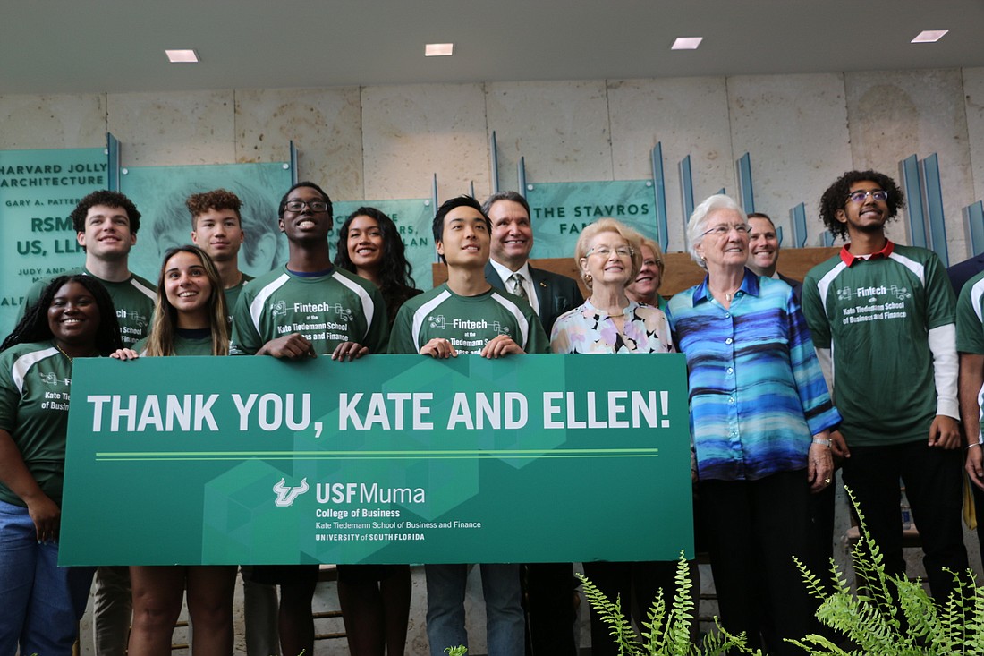 Courtesy. Ellen Cotton, third from right, and Kate Tiedemann, second from right, are pictured with University of South Florida business students following the announcement of their $14 million gift to USF Muma College of Business.