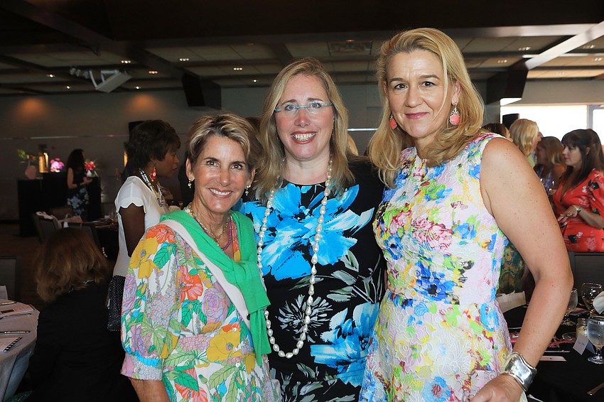 Audrey Robbins, president and CEO Jennifer Rominiecki and Pauline Wamsler