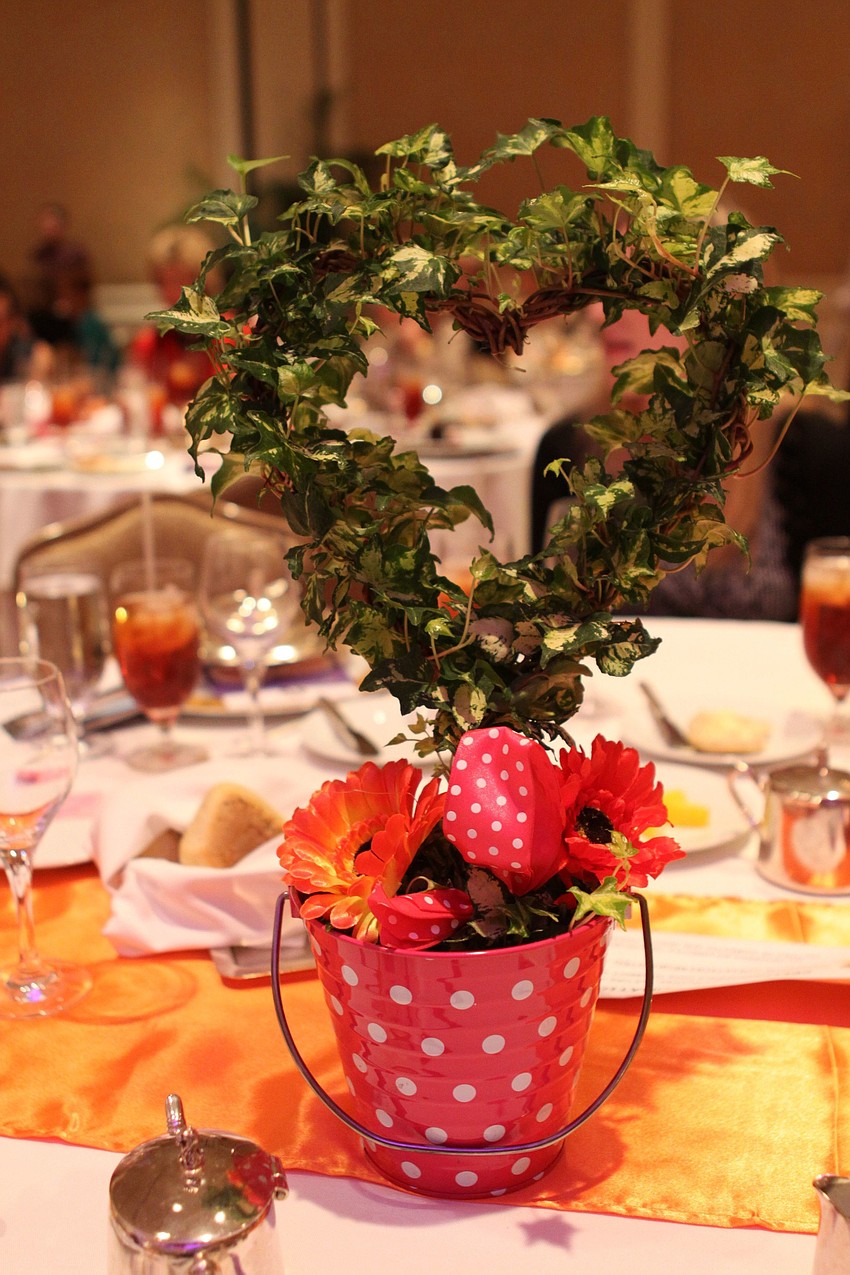 Each table had a beautiful heart-shaped topiary as the centerpiece. The centerpiece could be bought for $25.
