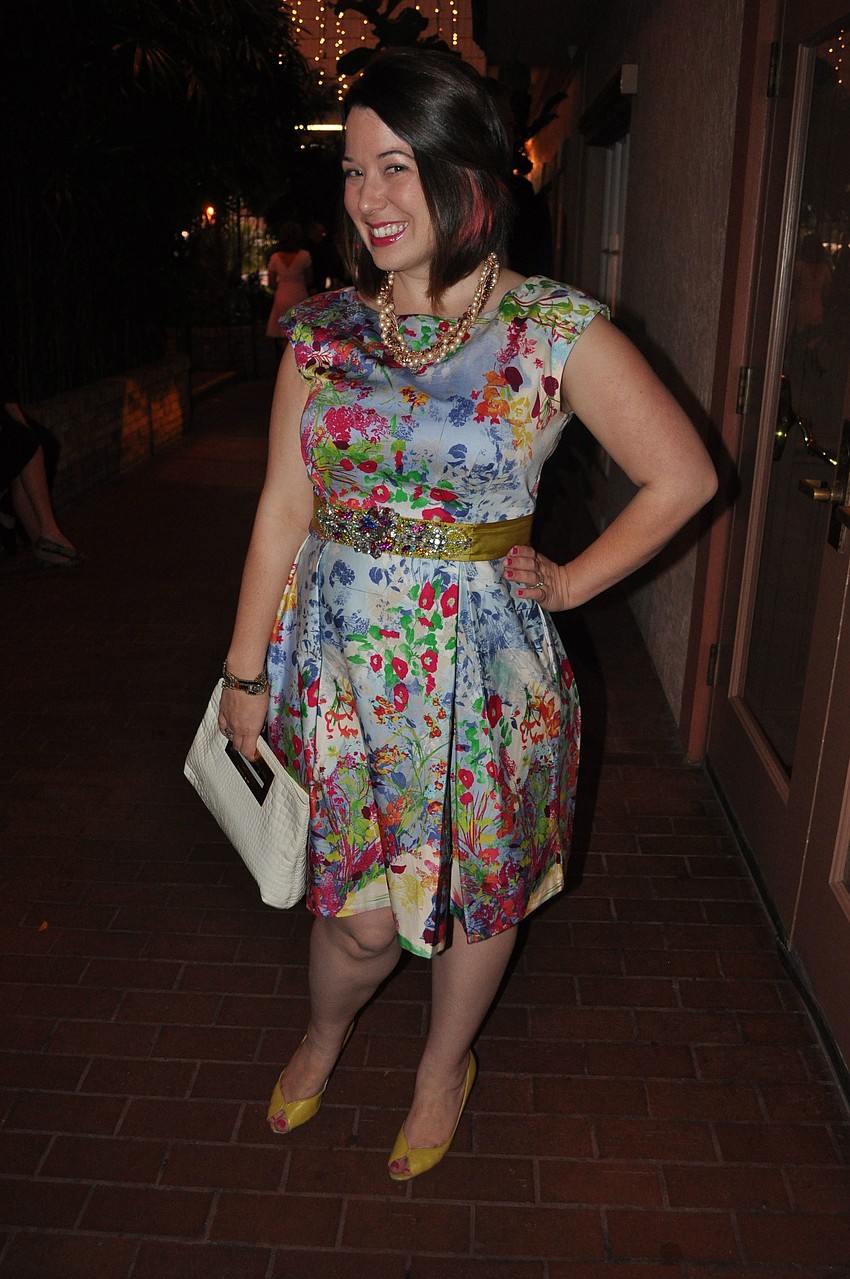 Lindsey Nickel in a dress from Modcloth, jewelry from Trebor and J. Crew and a Michael Kors handbag.