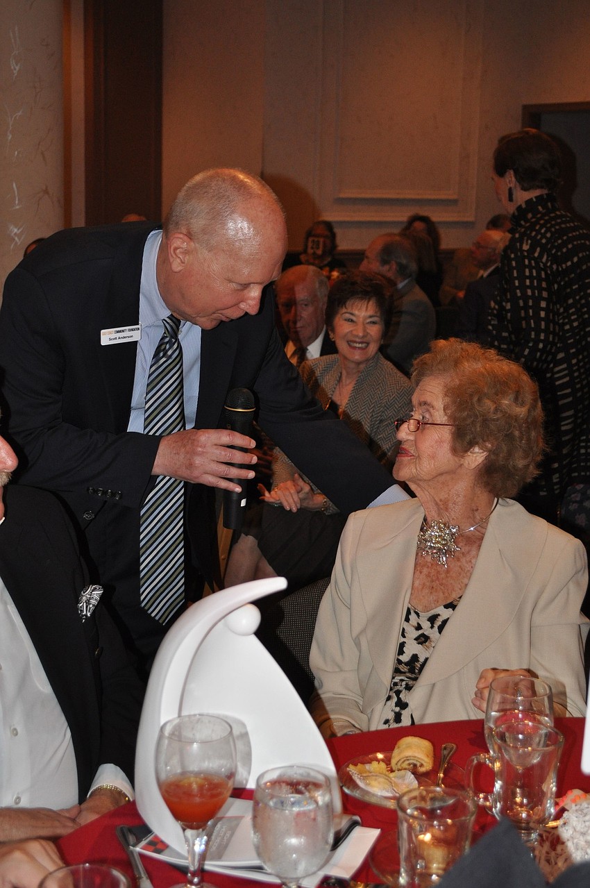 Honoree Betty Schoenbaum receives her award from Scott Anderson