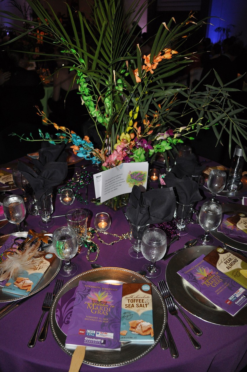The tables were decorated with, purple tablecloths, plenty of beads and centerpieces by Tropix.