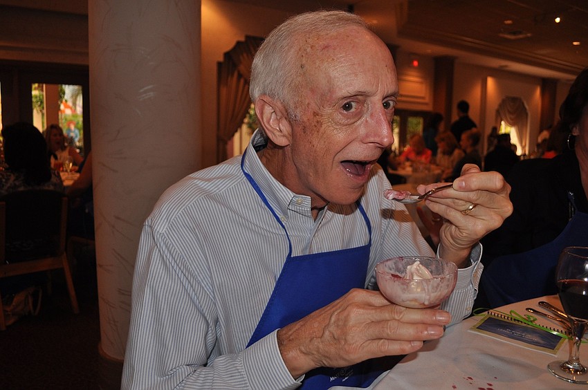 Peter Schneider enjoys his dessert.