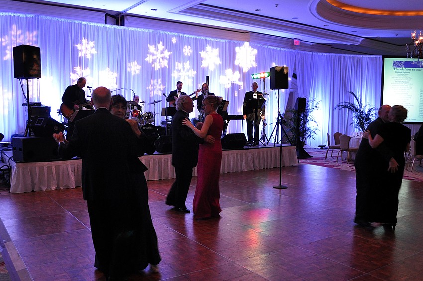Couples take to the floor to dance before dinner.