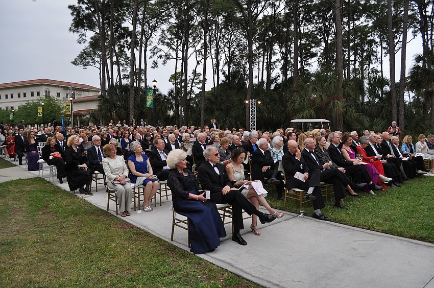 The attendees sat in chairs on the lawn of USF Sarasota-Manatee's campus to watch the performance.