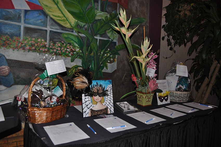 One of the many silent auction tables set up in the courtyard.