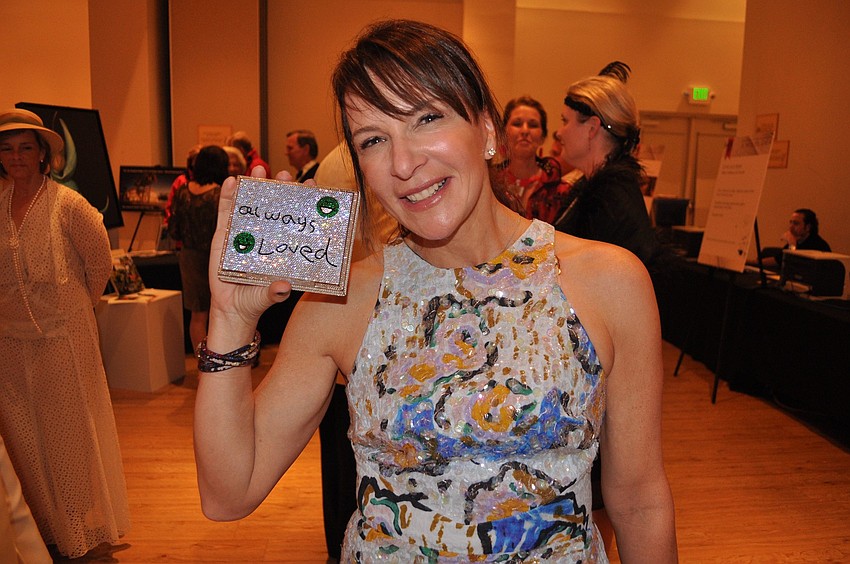 Christine Isaac shows off her adorable purse that was inspired by a letter her daughter wrote her when she was six.