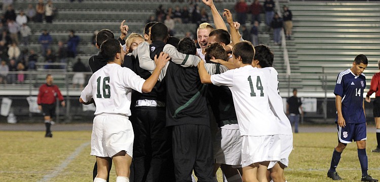 The Lakewood Ranch High boys soccer team celebrates following its 2-1 victory over Manatee in the Class 4A-District 11 championship Jan. 25.