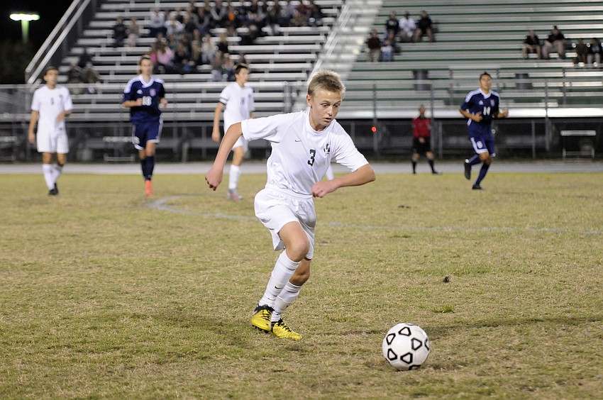 Lakewood Ranch sophomore midfielder Jake Dube pushes the ball up the field.