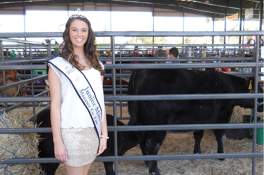 Junior Miss Manatee County Fair Sarah Adams stands by her cow/calf pair, Bella and Olivia. Courtesy photo.