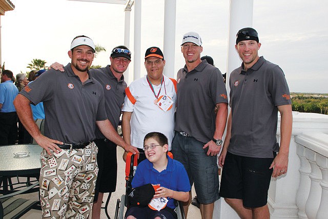 Miracle League of Manasota baseball player Seth Morano enjoyed spending time with the Baltimore Orioles players, including Jim Johnson, far right. Courtesy photo.