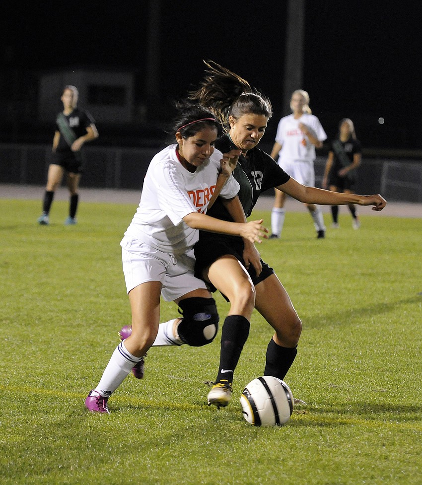 Lakewood Ranch senior midfielder Chelsea Martin battles a Plant City defender for possession.