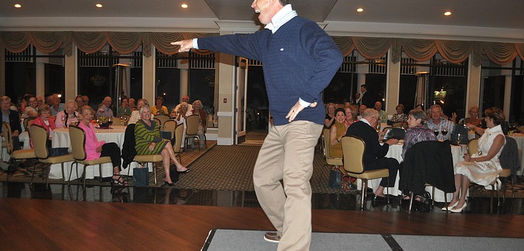 Tennis pro Claudiu Retean struts down the catwalk.