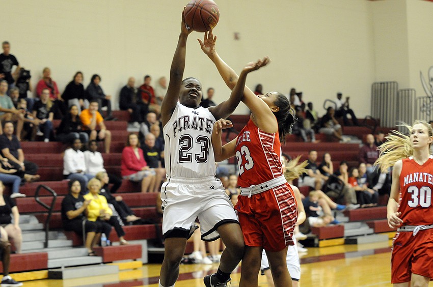 Braden Riverâ€™s Charity Landrum is fouled while going up for a layup.