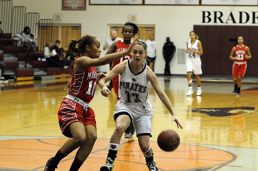 Braden River senior Erica Glisson attempts to dribble past Manateeâ€™s Aja Nixon.