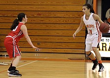 Port Charlotteâ€™s Jess Hevia, No. 20, tries to defend against Sarasotaâ€™s Kylie Warner, No. 11.