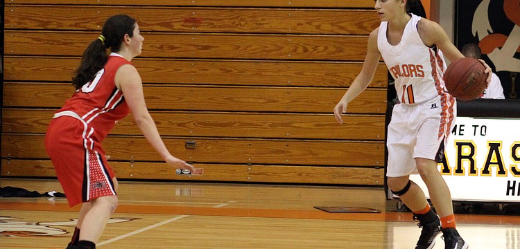 Port Charlotteâ€™s Jess Hevia, No. 20, tries to defend against Sarasotaâ€™s Kylie Warner, No. 11.