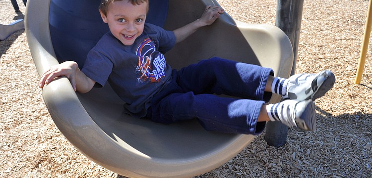 Austin Bruce, 6, couldnâ€™t get enough of the slide.