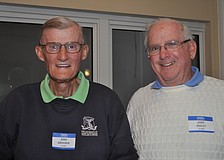 John Brouder and John Bailey tend bar at the Beachplace Super Bowl party.