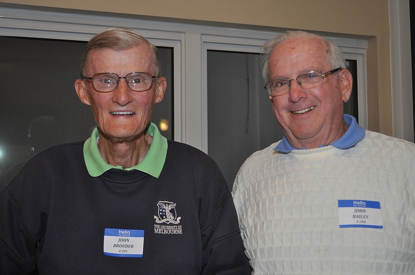 John Brouder and John Bailey tend bar at the Beachplace Super Bowl party.