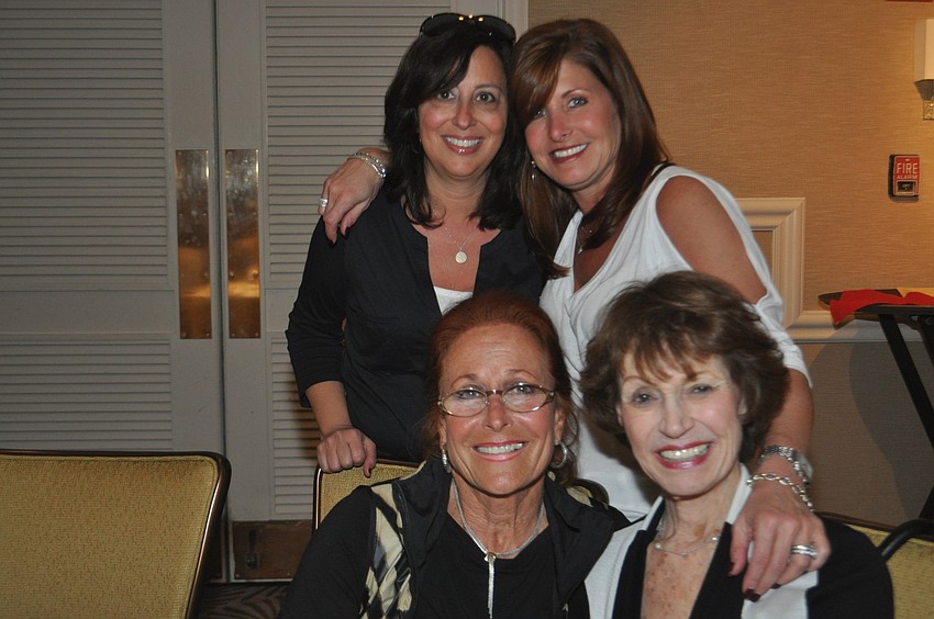 front, Renee Ross, Barbara Vornoff, back, Carrie Goodman and Julie Brown at the Longboat Key Club Super Bowl party