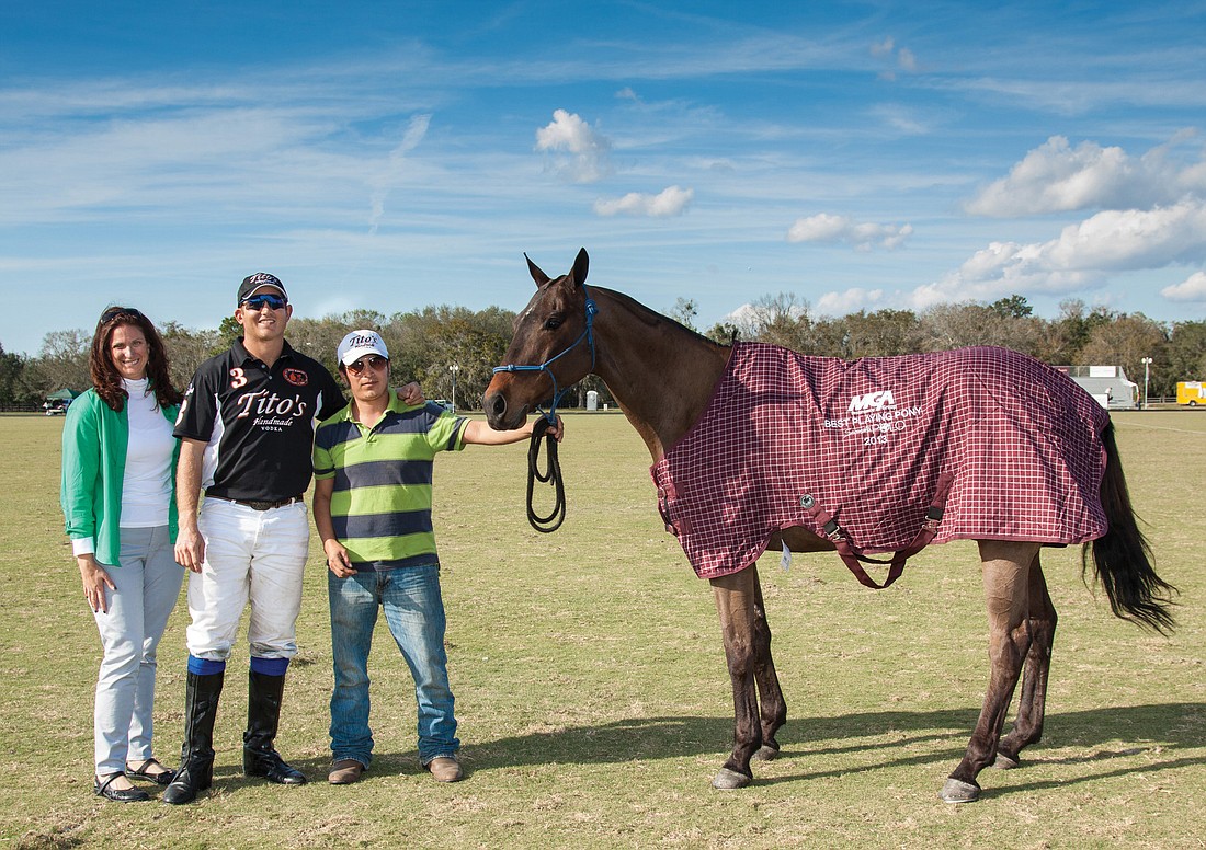 Tito's Steve Krueger, center, received the Best Playing Pony award for his horseÃ¢â‚¬â„¢s performance in the fourth chukker. Courtesy photo.