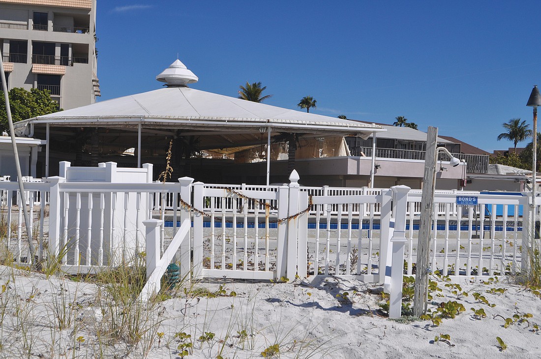 The cabana tent at the pool is tattered and is visible from the beach outside the Colony Beach & Tennis Resort.