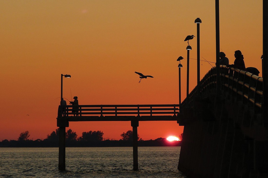 Paula Lunn submitted this photo of a sunset at the Ringling Bridge Pier.