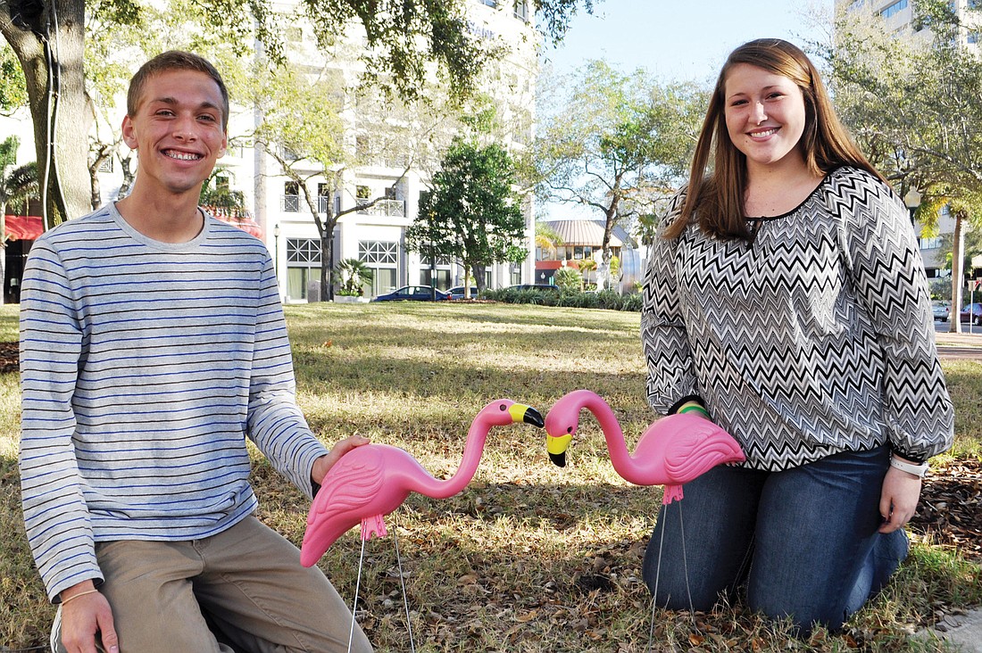 Alyssa Sweeney and Jack Boeve, Relay for Life co-captains, with the lawn flamingos